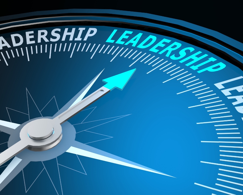 Compass needle pointing to the word Leadership