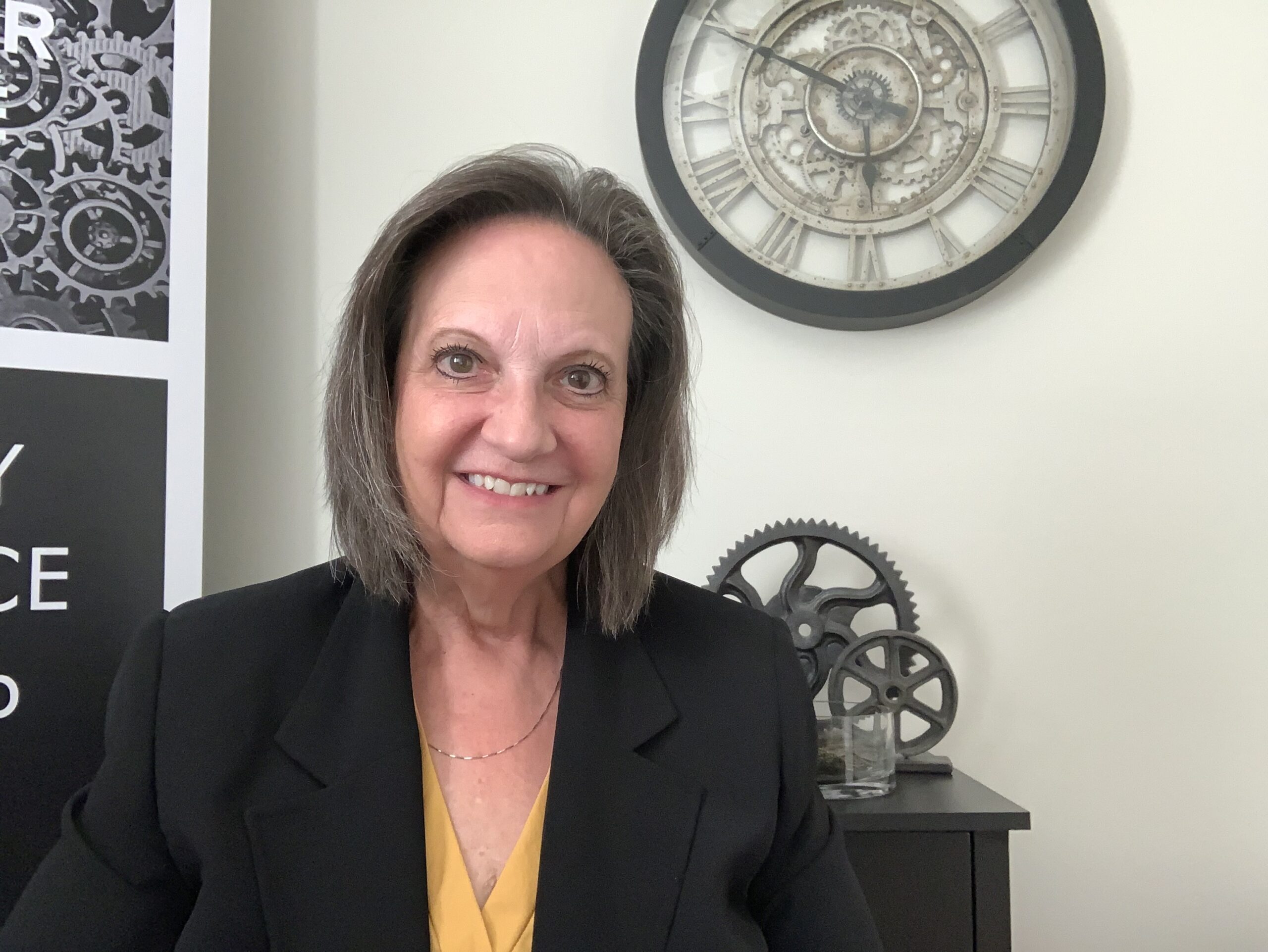 Gianna C. Clark, founder of Everyday Excellence Leadership, seated in her office