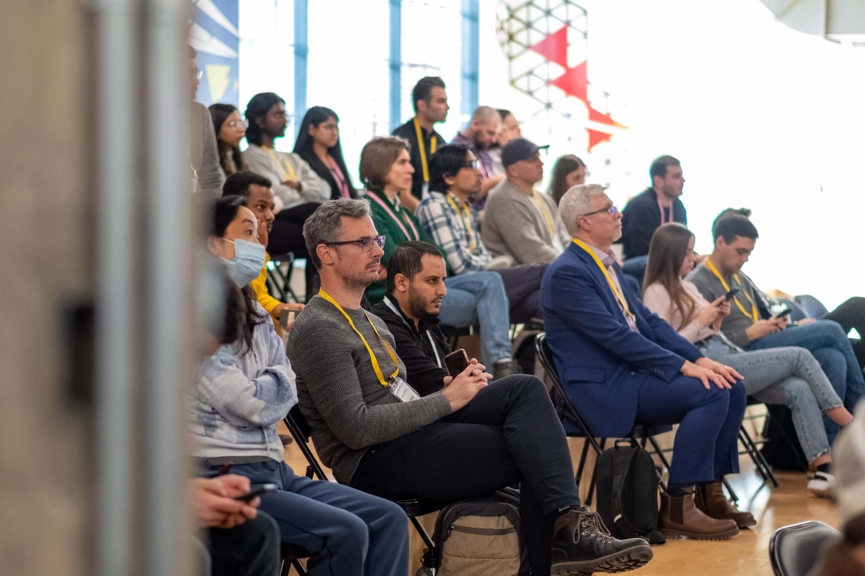 Audience seated in rows watching a session at an EvolveDigital conference
