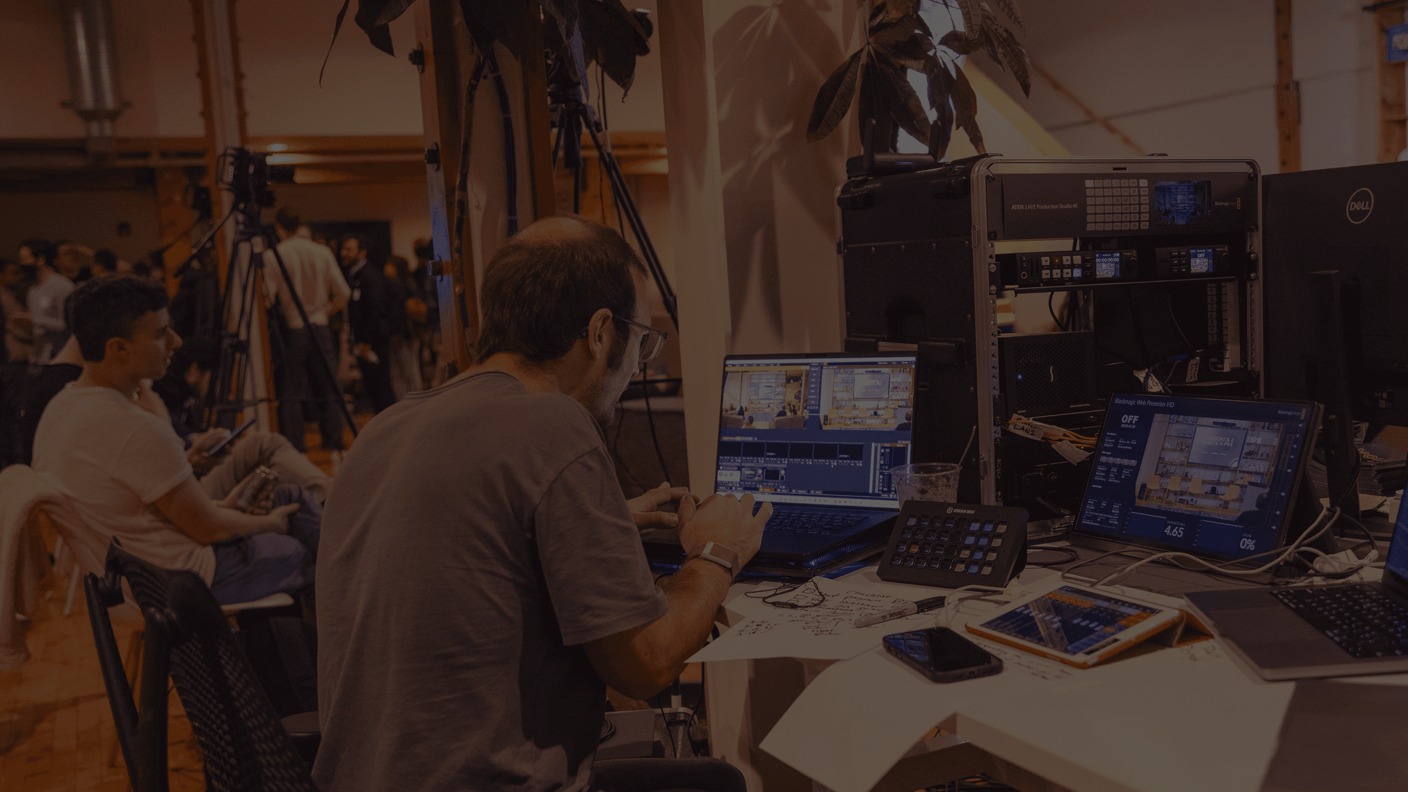 Eyes Up technician running the video switcher at a live event.