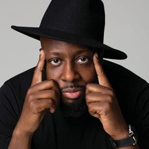 Portrait of Wyclef Jean in a black hat