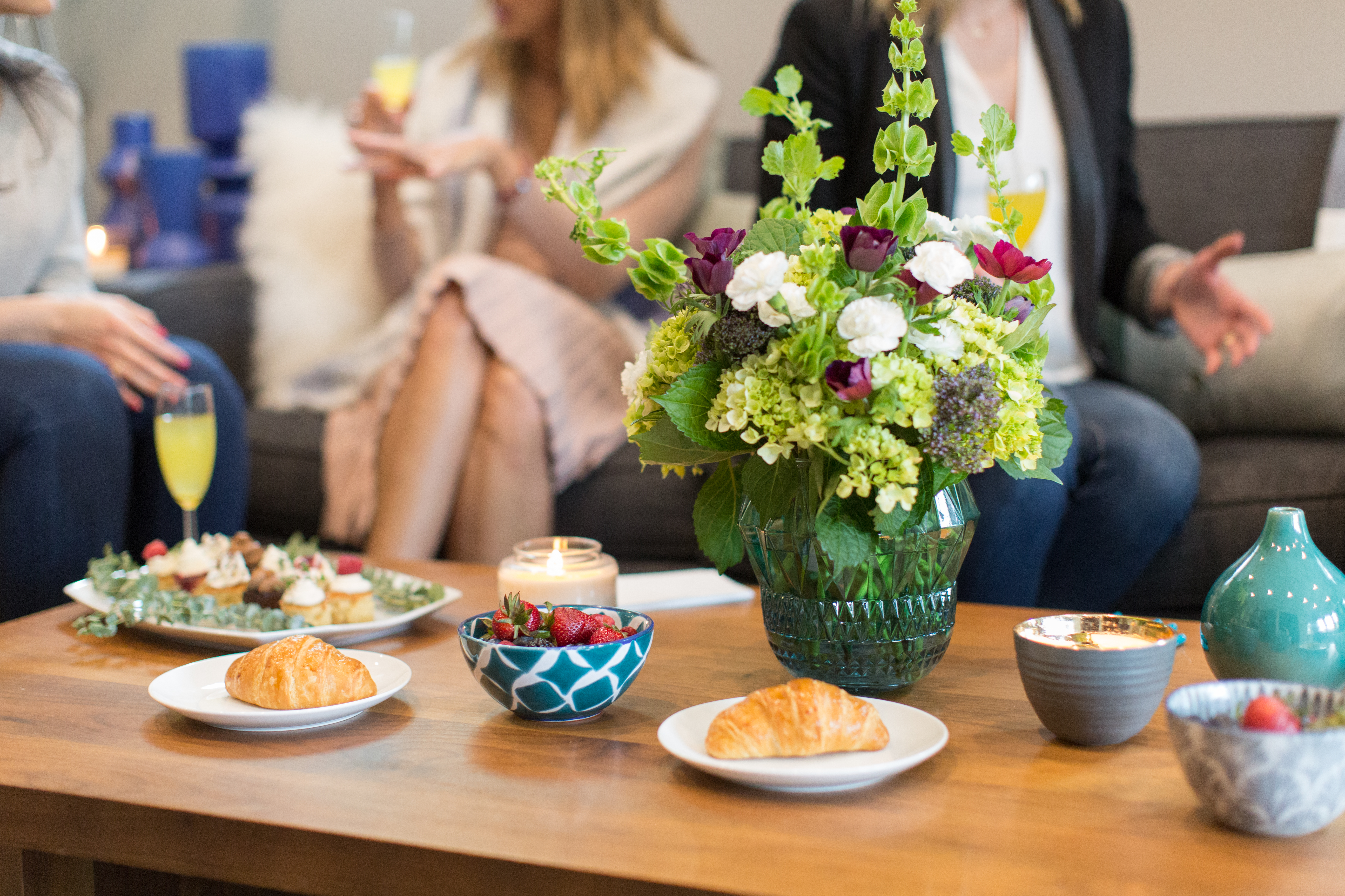 Retreat refreshment table with pastries, strawberries and flowers