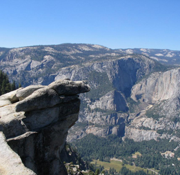 Aerial view of Glacier Point overlooking a forested valley in Yosemite