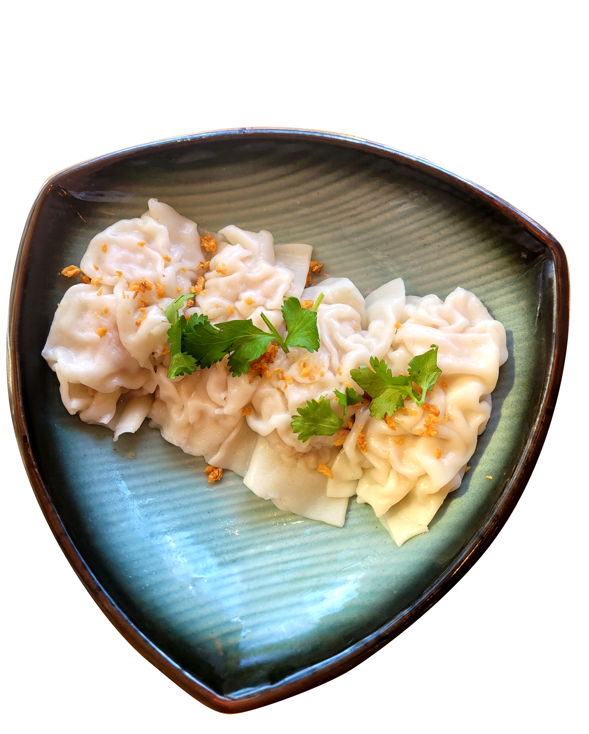 Steamed dumplings on a triangular teal ceramic plate with crispy garlic and cilantro