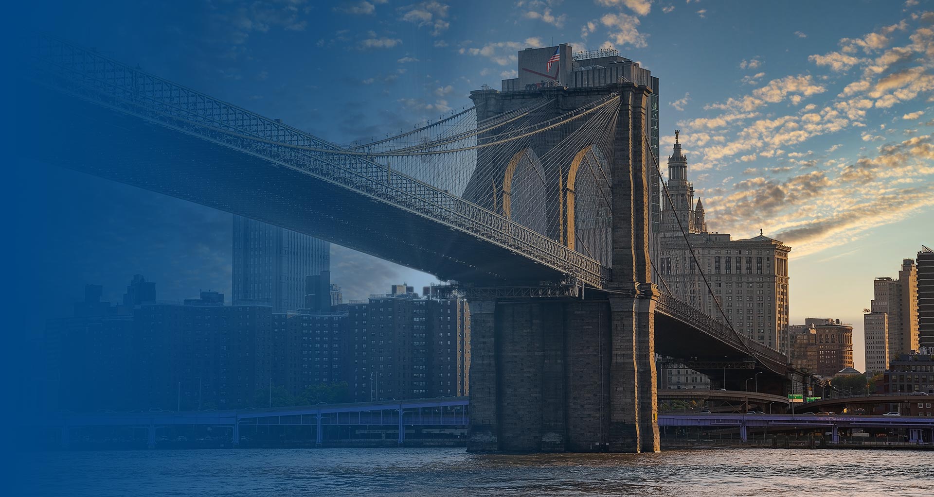 Brooklyn Bridge at sunset over the East River