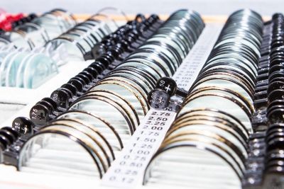 Rows of optical trial lens sets with labeled prescription values in the HMY Vision lab
