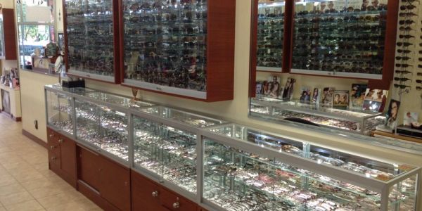 Inside HMY Vision's Gramercy Park store: large wall display cases filled with eyeglass frames