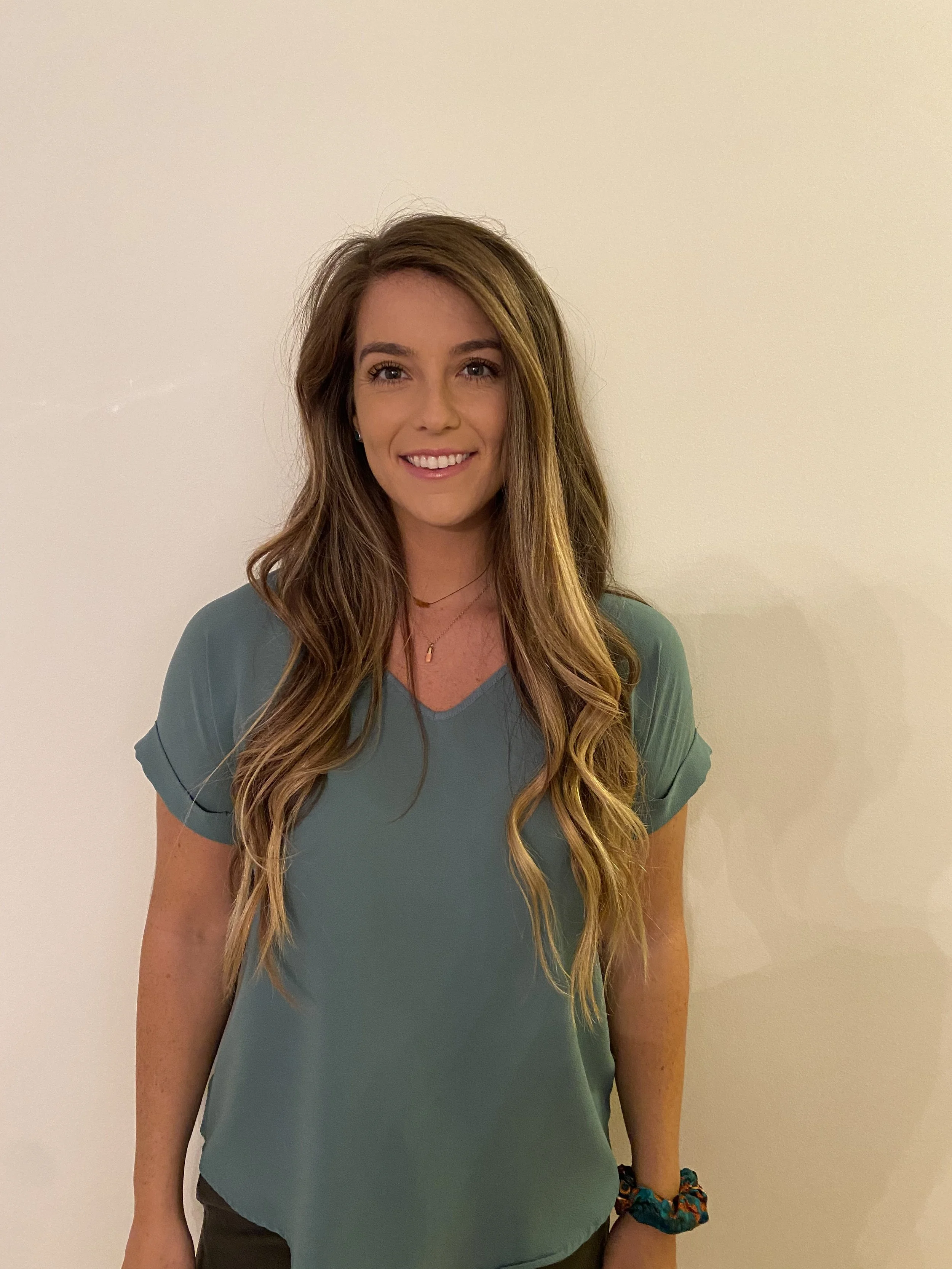 Shannon Keane, PT, DPT — headshot in a teal v-neck top