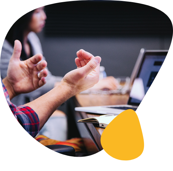Close-up of a person gesturing with their hands during a workshop