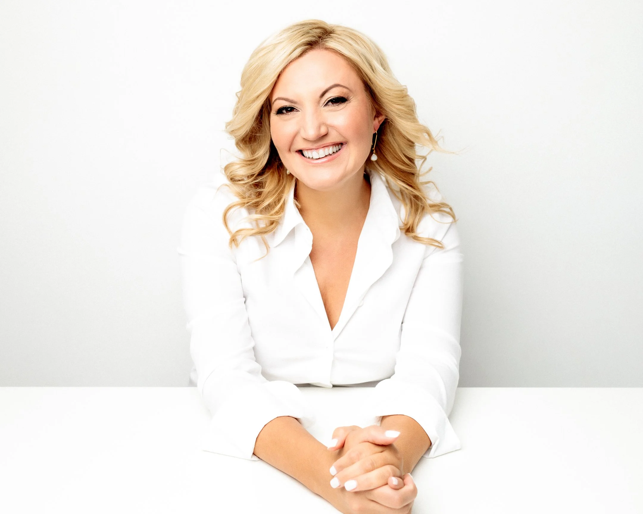 Melissa Severance, smiling in a white blazer