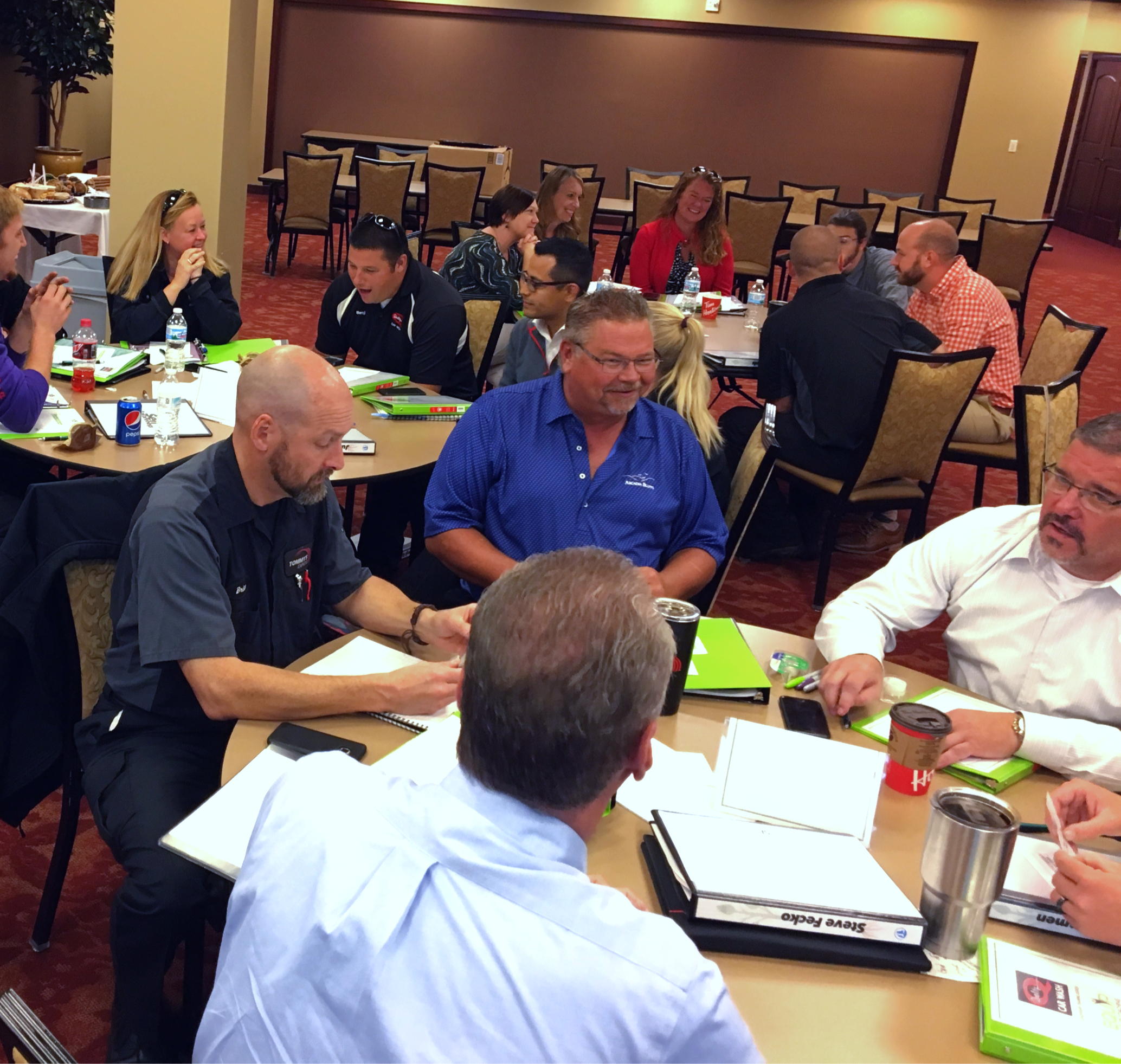 Large group of business professionals at a leadership training session