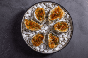 Lahsooni oysters on white pebbles