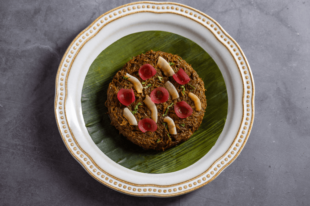 Venison Varuval plated with pickled onion and coconut at Ishq