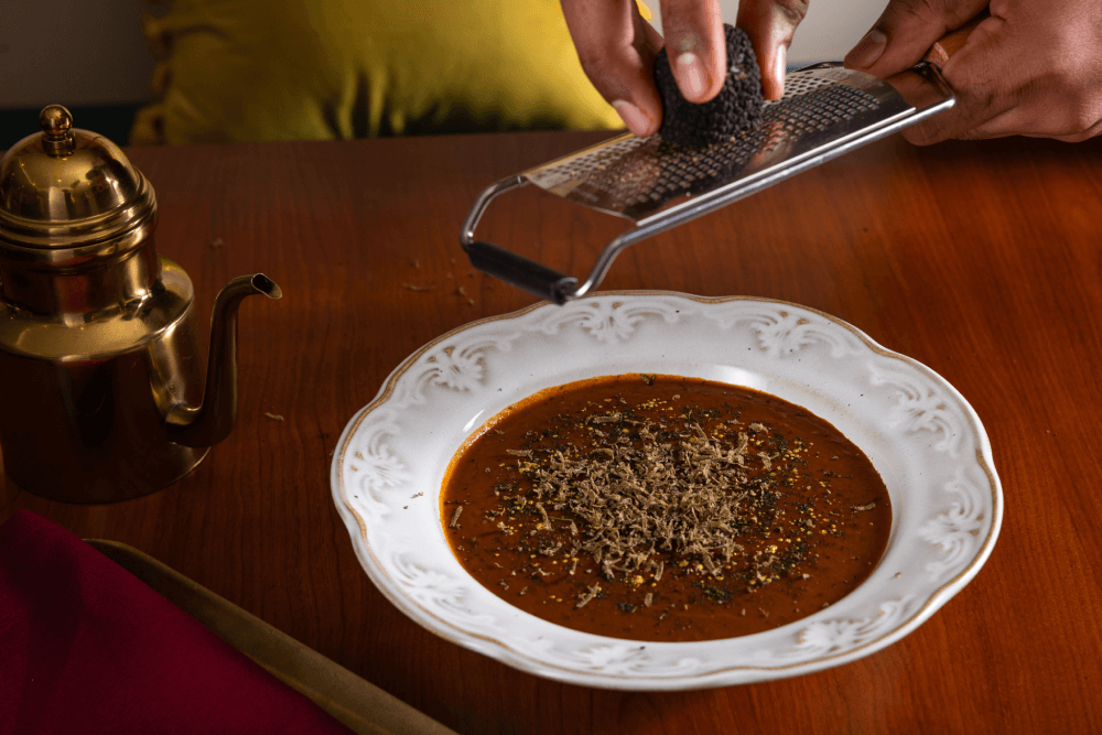 Black truffle grated by hand over Ishq Dal-E-Khaas