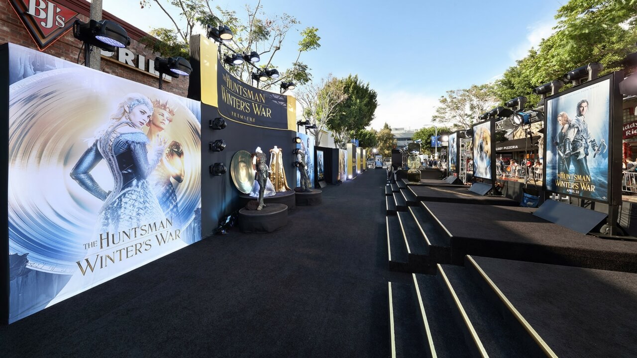 The Huntsman Winter's War movie premiere outdoor red carpet with large branded banners