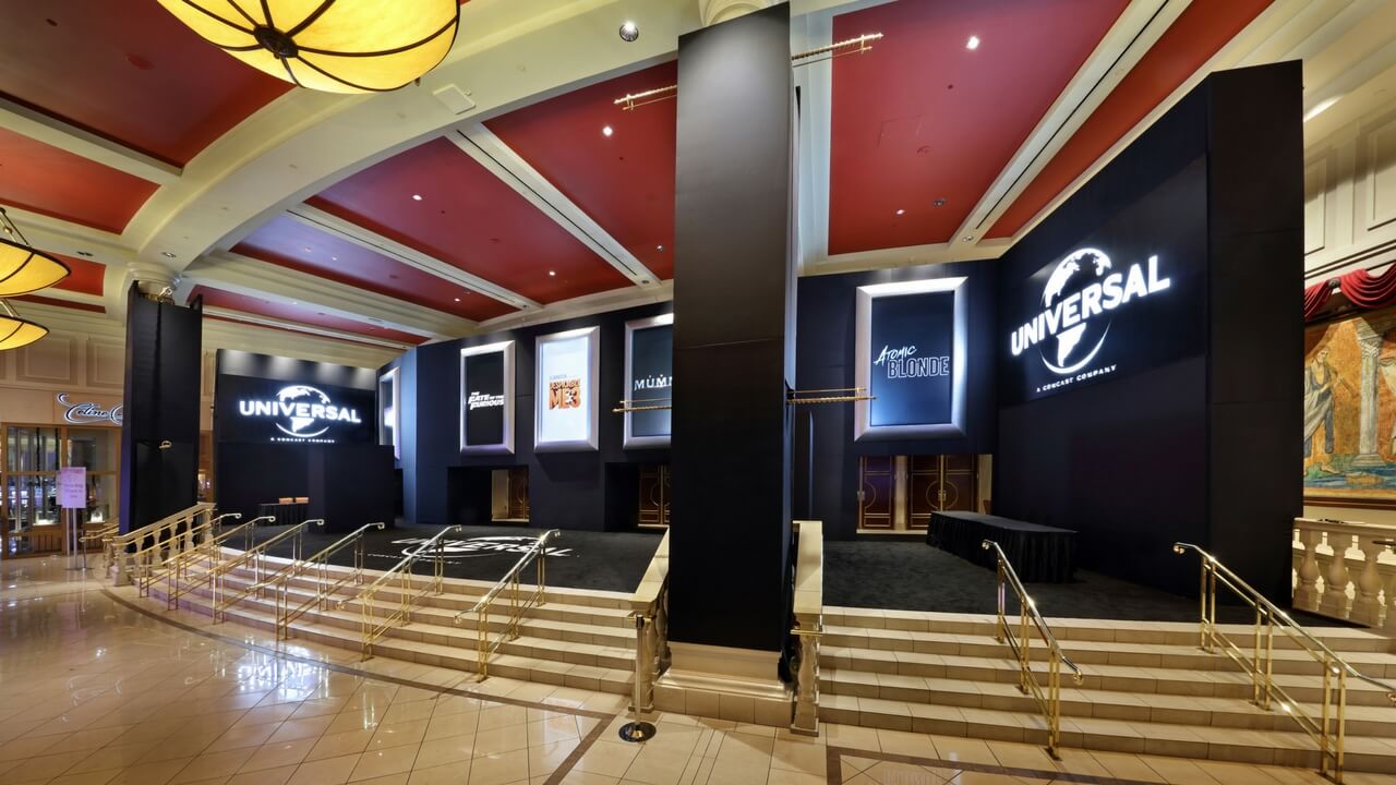 CinemaCon Universal Studios event interior with branded movie displays in elegant venue