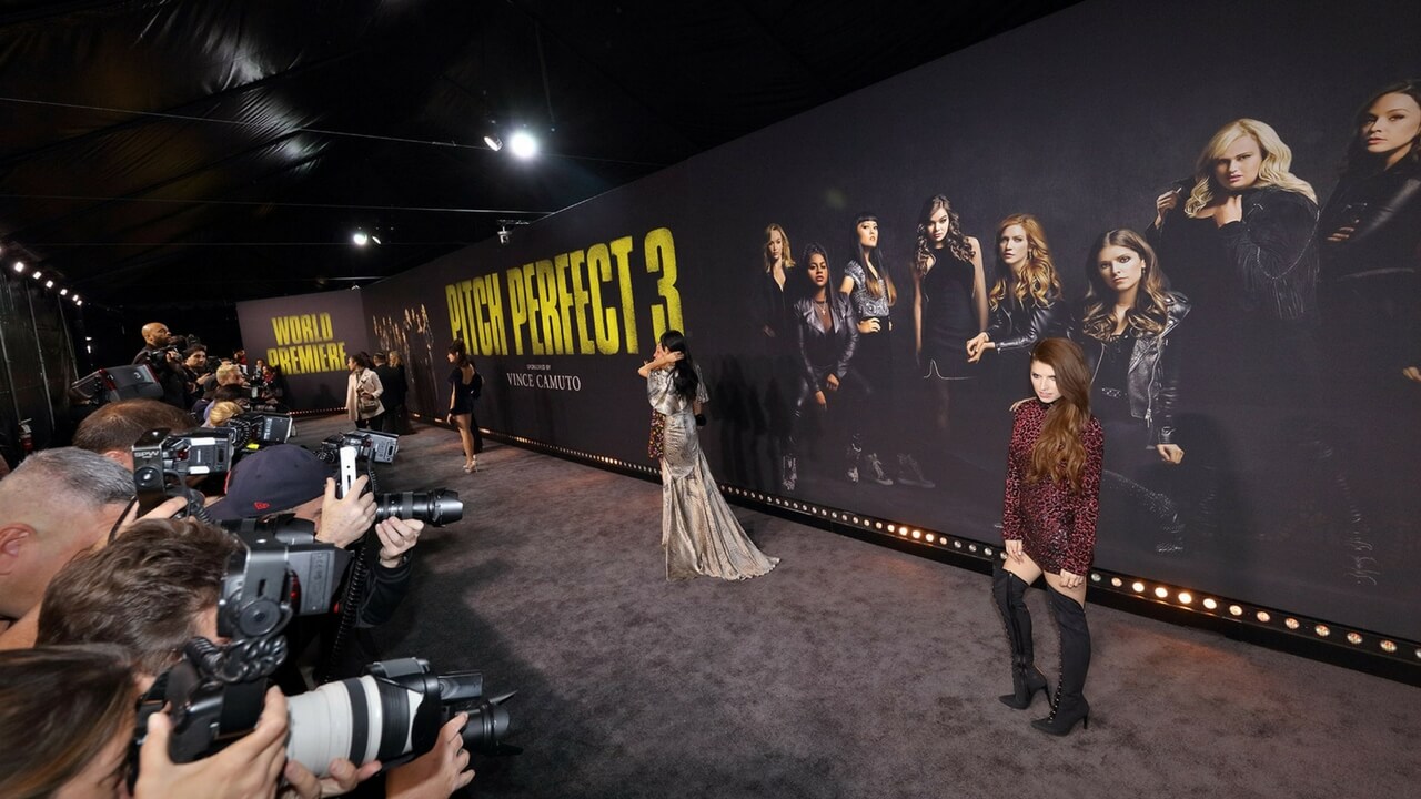 Pitch Perfect 3 premiere red carpet with movie poster backdrop