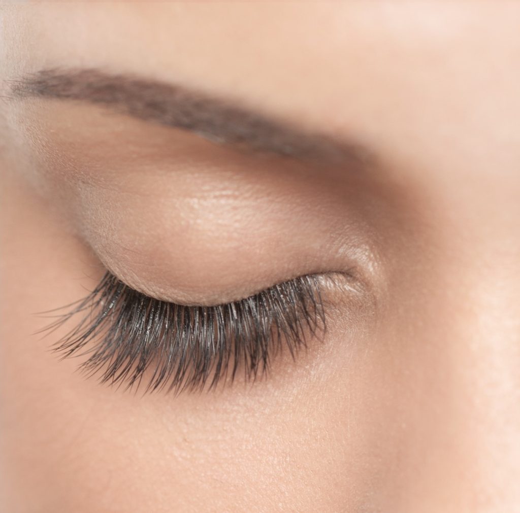 Close-up of a single closed eye with lashes