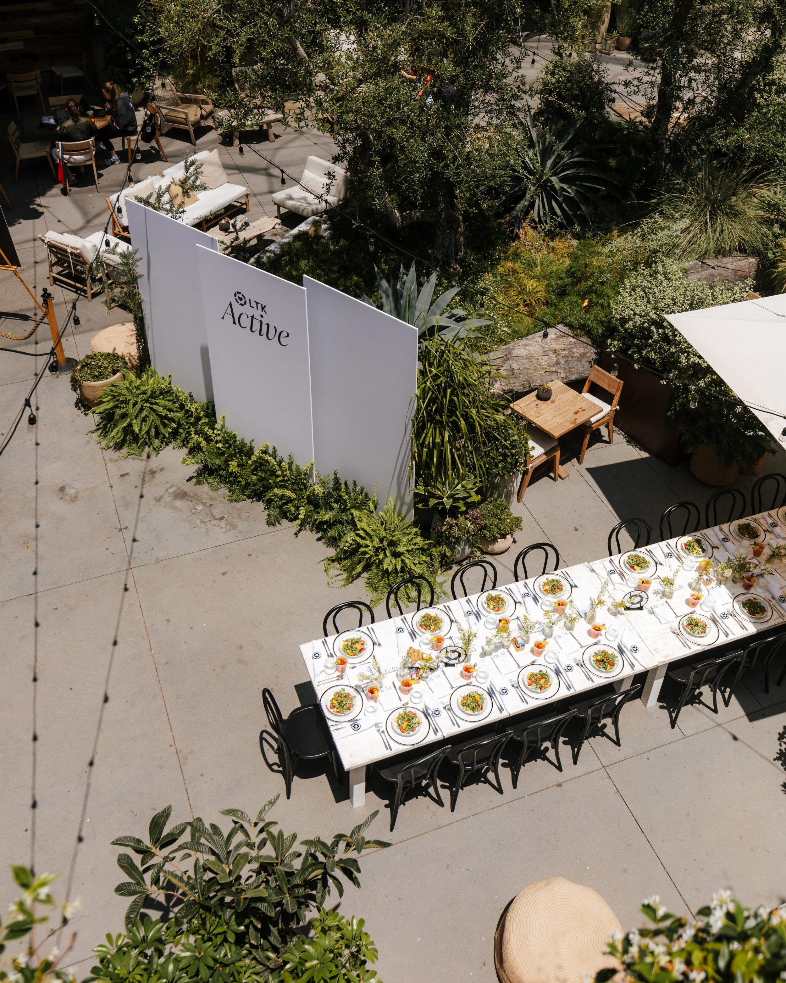 Aerial view of the LTK Active Summit outdoor dining table dressed with florals