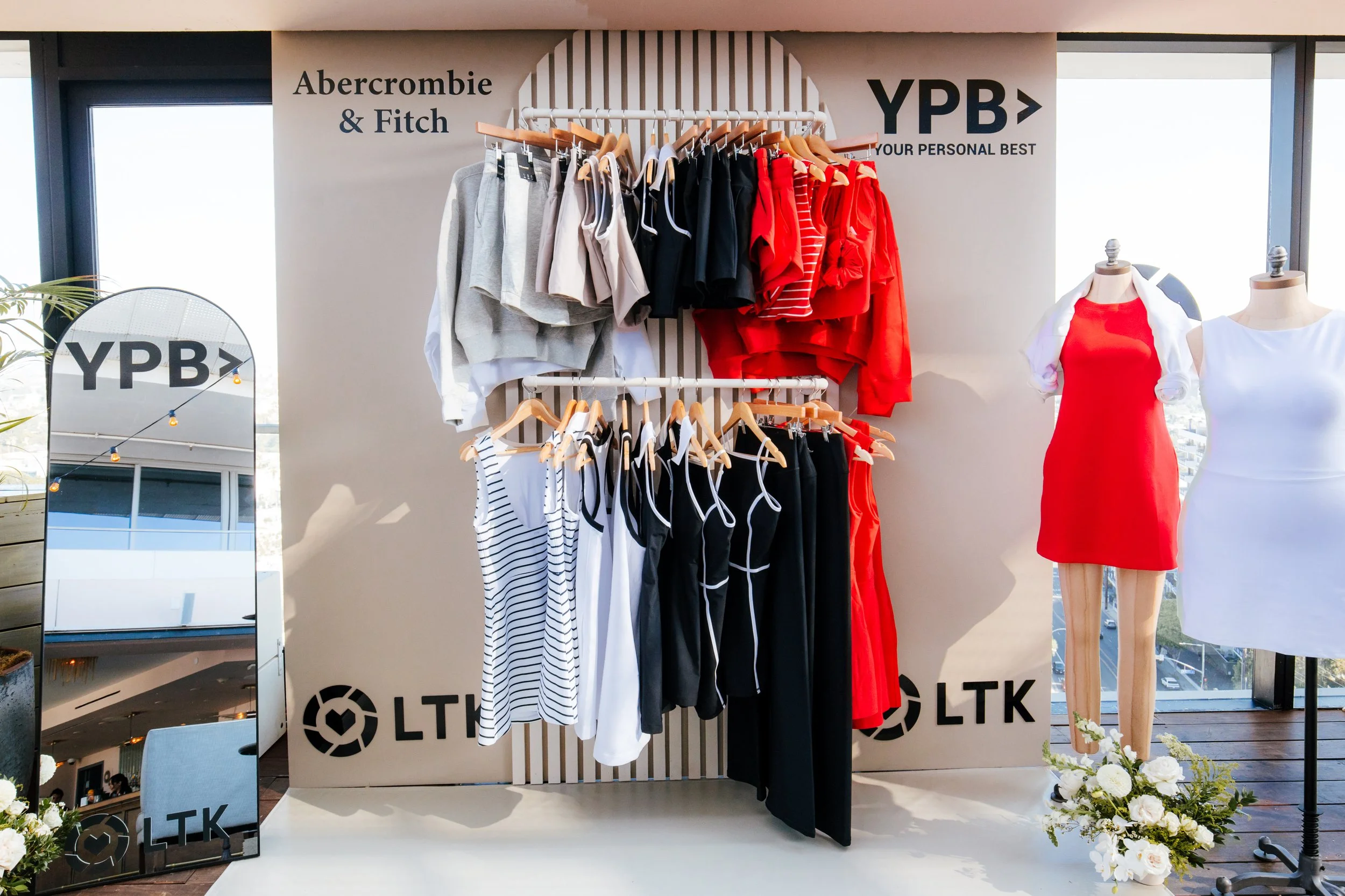 Abercrombie & Fitch YPB activewear display wall with rack and mannequins