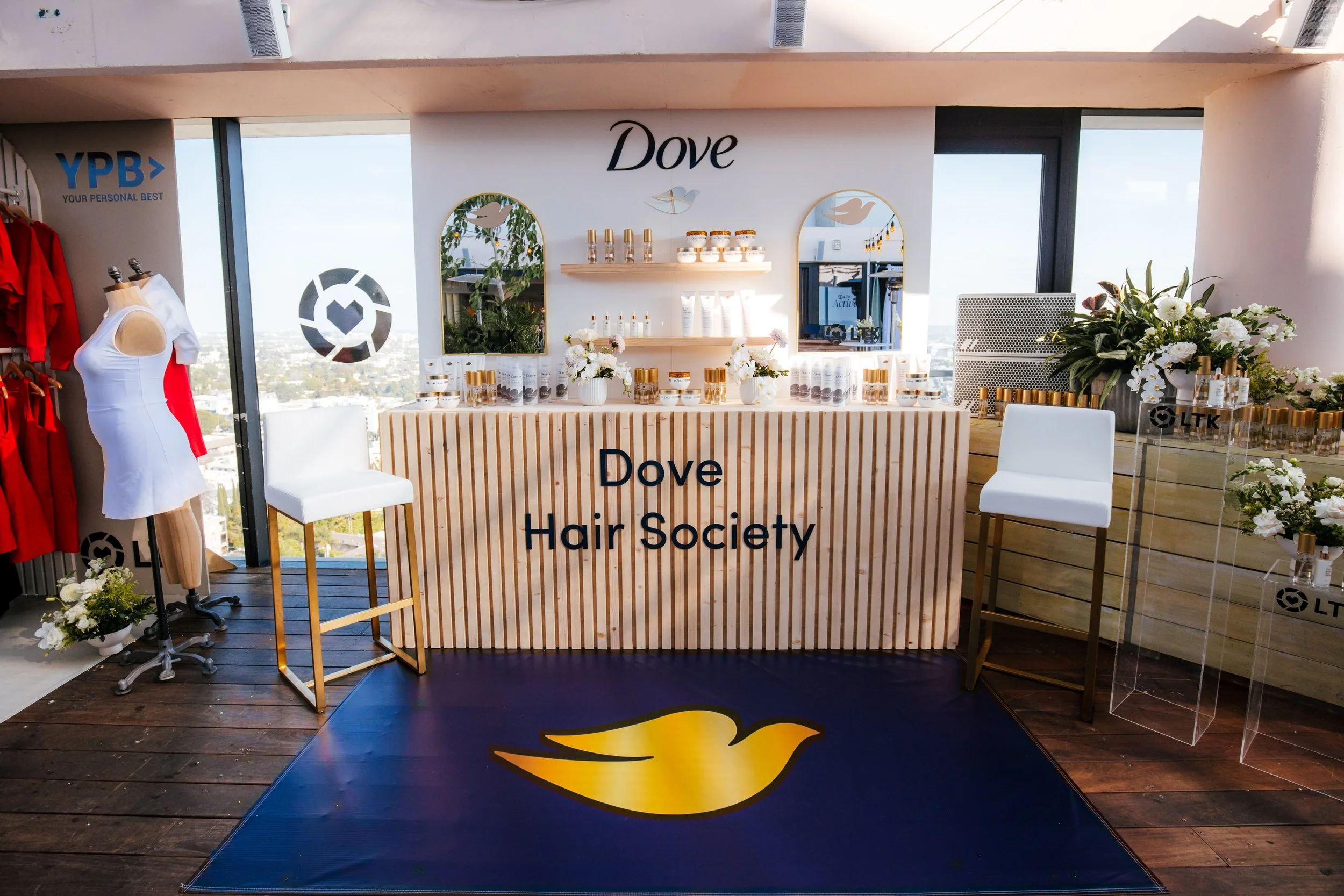 Dove Hair Society branded activation bar on a rooftop terrace