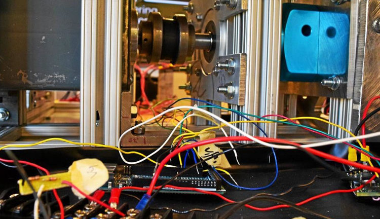 Close-up of an Oscillo Drive unit prototype on a workbench