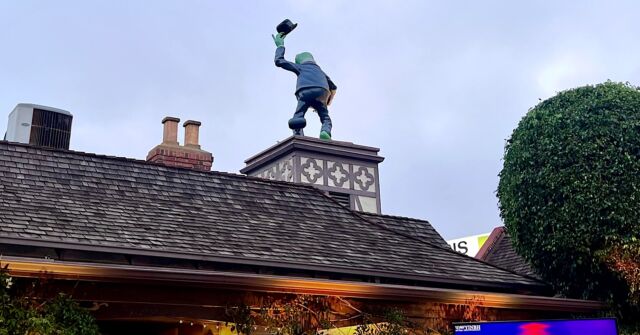 Green statue on rooftop at The Grill
