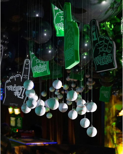 Baseball-themed party detail with green foam fingers