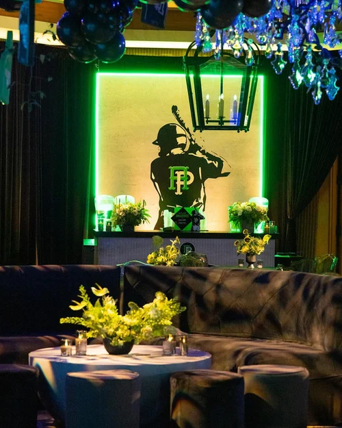 Themed bar area with neon batter silhouette