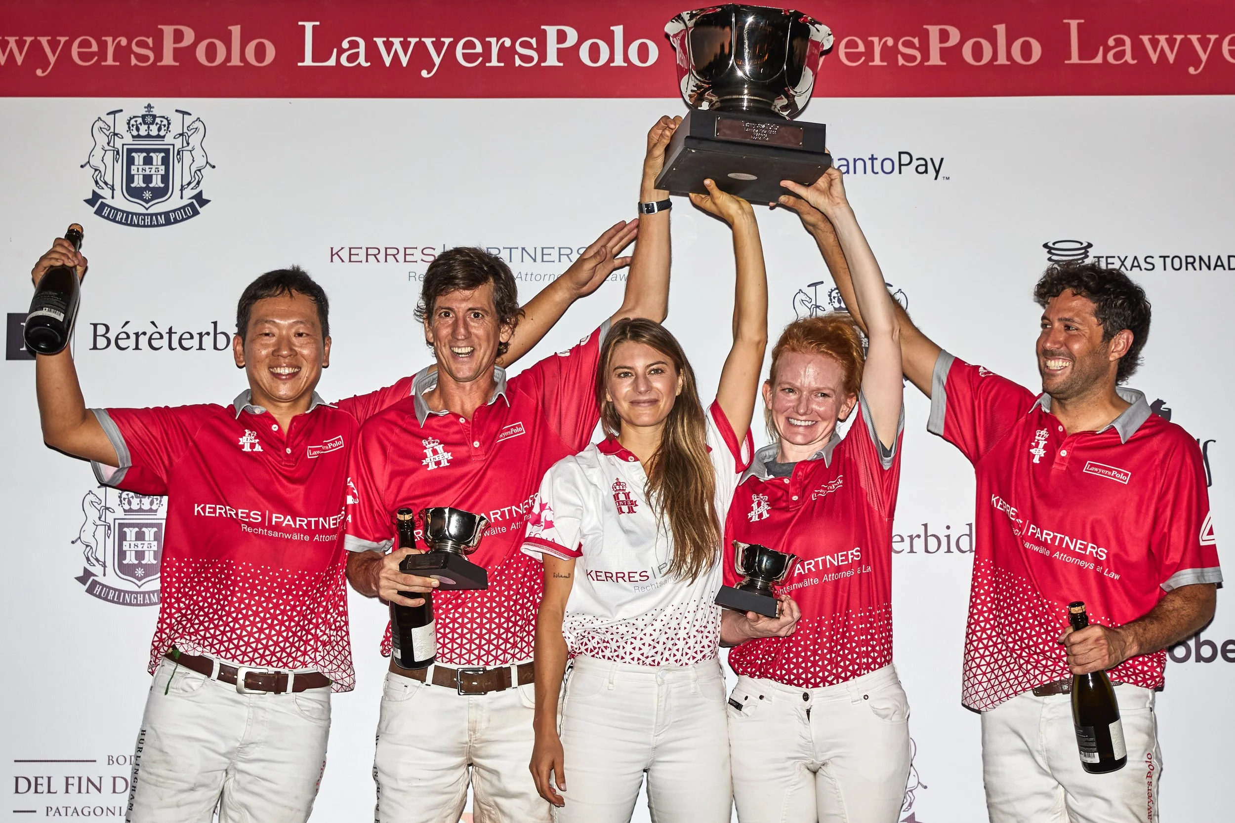 Kerres Partners team on the awards podium raising the Lawyers Polo trophy in Buenos Aires