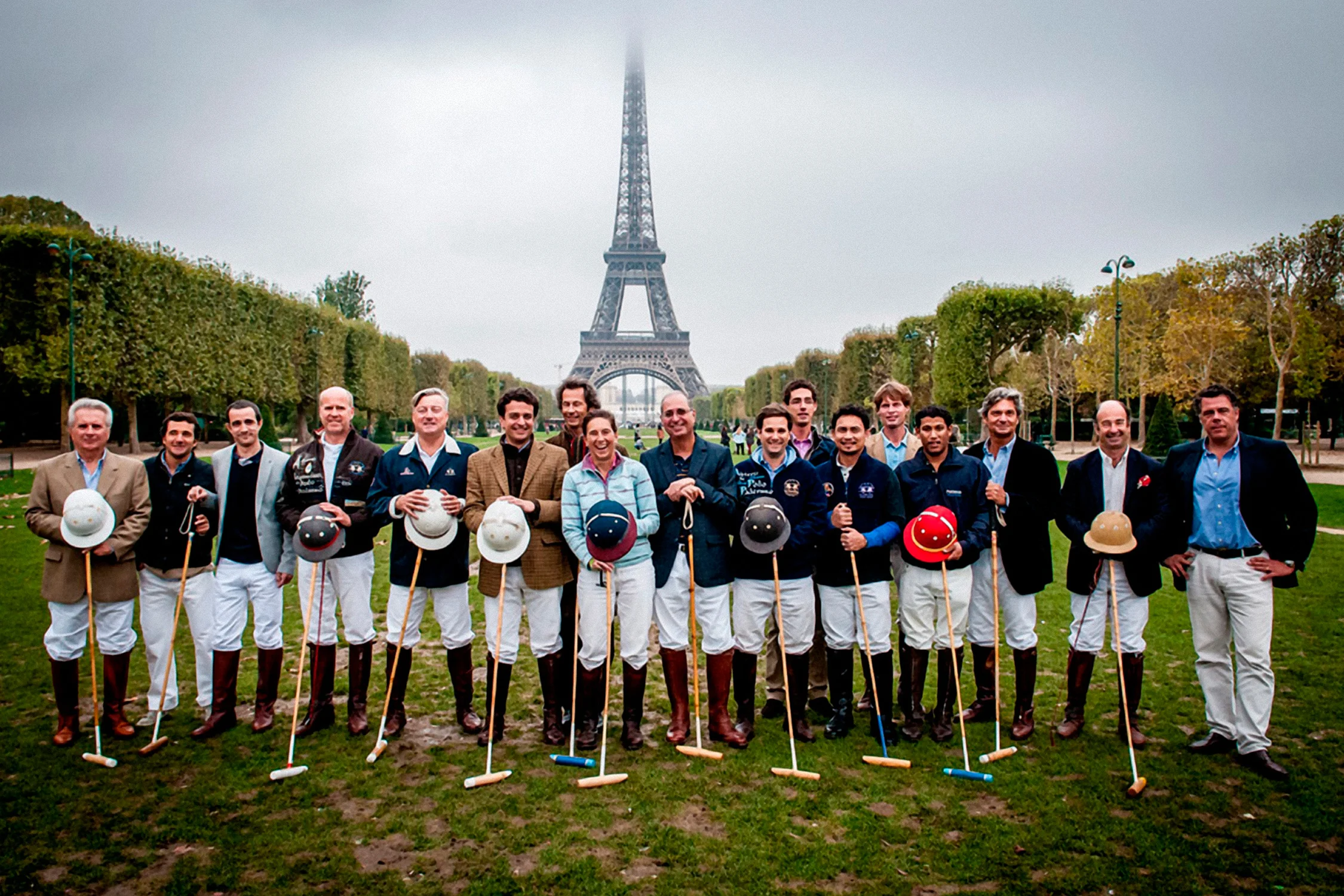 Team posed with mallets in front of the Eiffel Tower, Paris