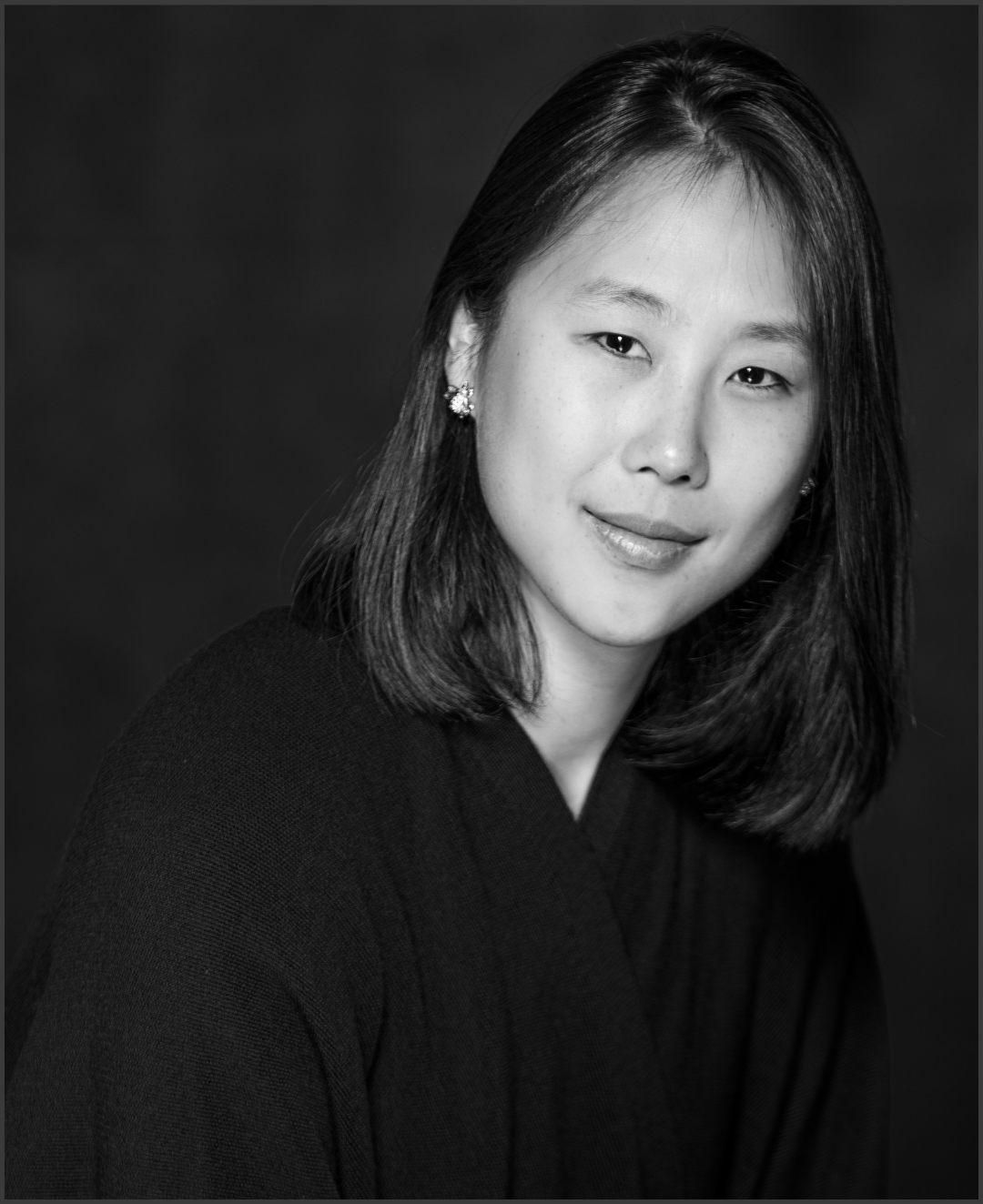 Black and white portrait of Ming Min Hui