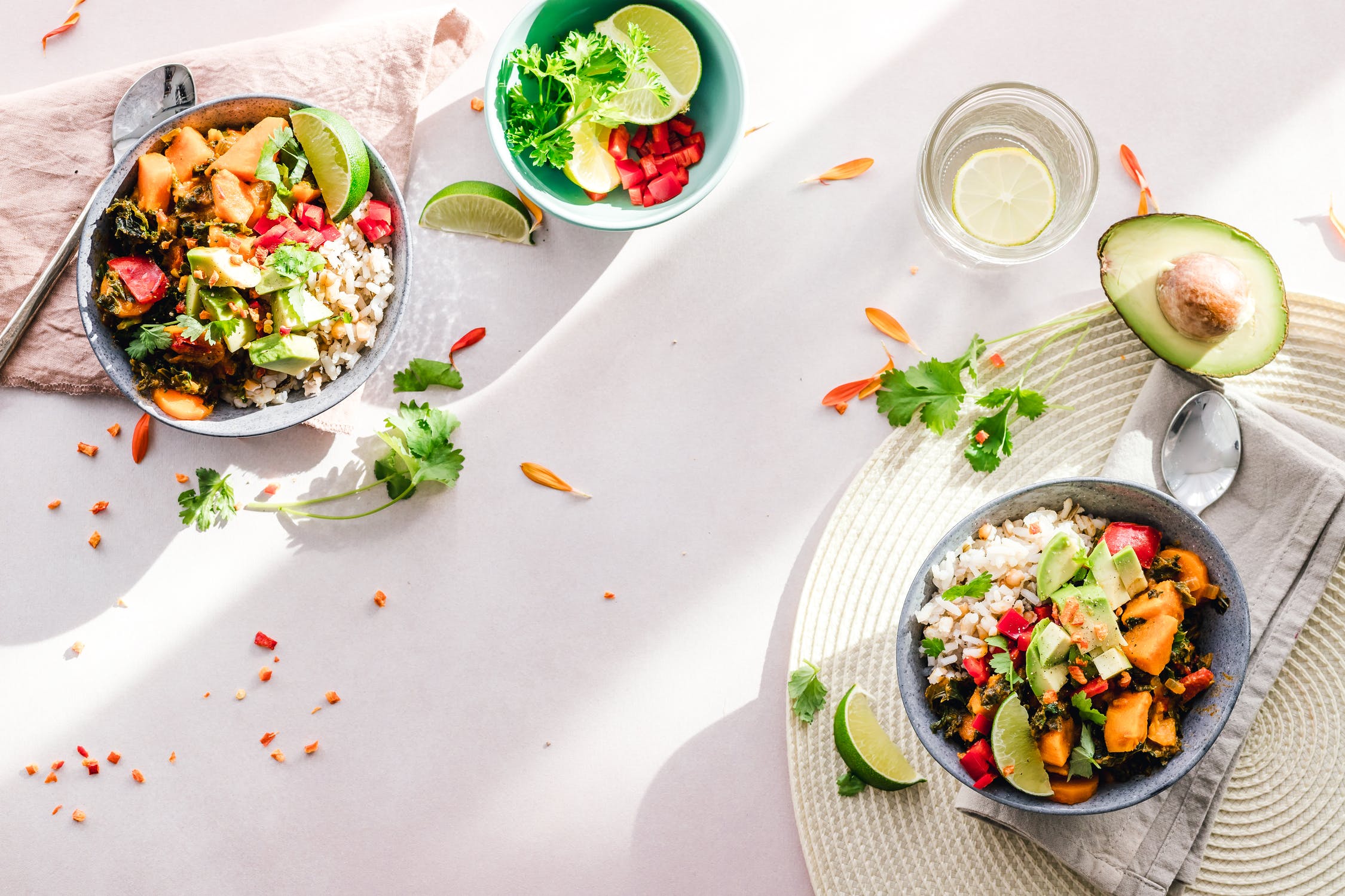 Two colourful vegan Buddha bowls, flat-lay
