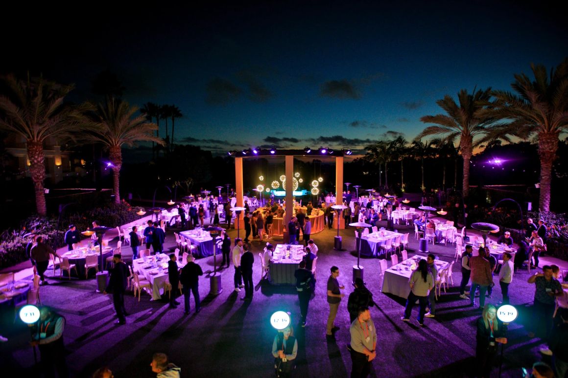 Aerial view of an outdoor evening event, darker exposure