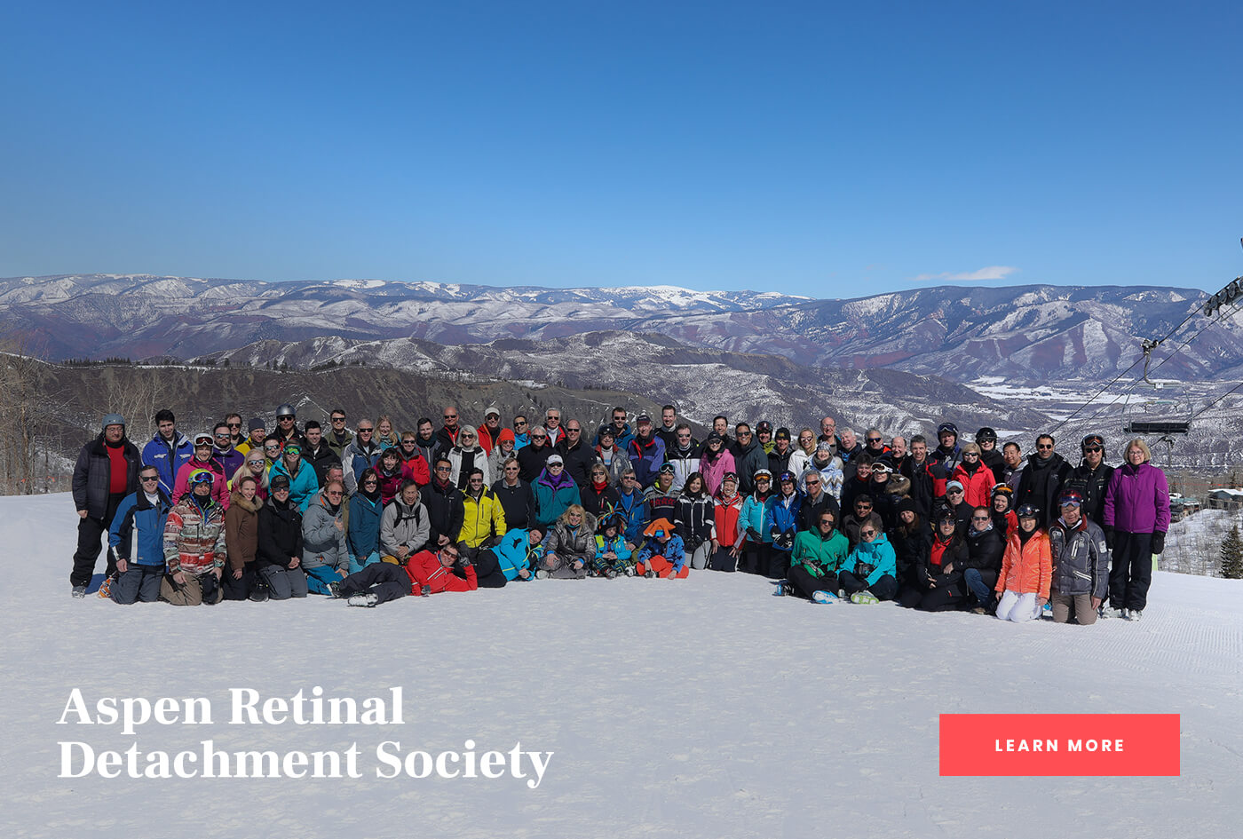 Attendees in ski gear on a snowy slope at the Aspen Retinal Detachment Society