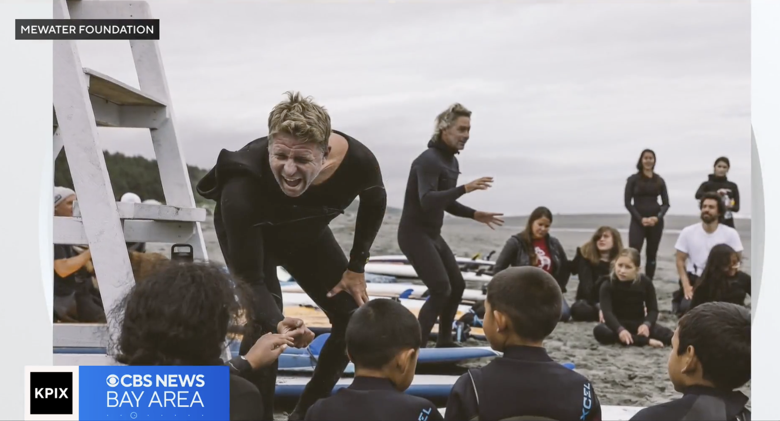 KPIX CBS News Bay Area broadcast still of a MeWater instructor coaching youth on the beach