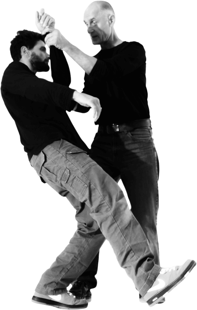 Two men in a dynamic Krav Maga sparring move