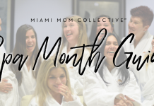 Women in white spa robes laughing together