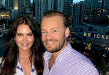 Couple posing on a Brickell rooftop at night