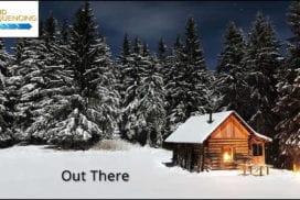 Glowing log cabin in a snow-covered pine forest
