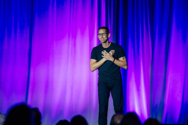 Hal Elrod speaking on stage at a live event