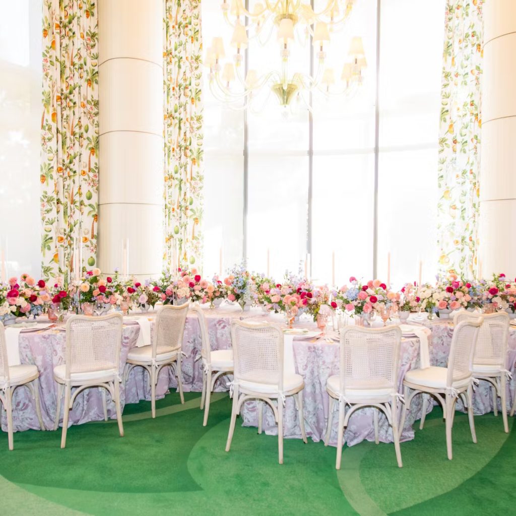Floral-decorated ballroom table with chandelier