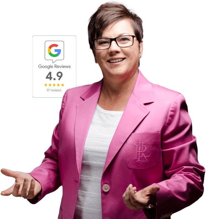 Coach Mo Faul in a bright pink blazer gesturing outward, with a 4.9-star Google Reviews badge