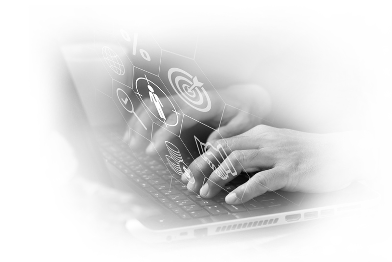 Hands typing on a laptop with program icons overlaid
