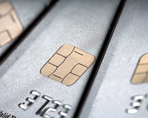 Close-up of stacked EMV chip credit cards.