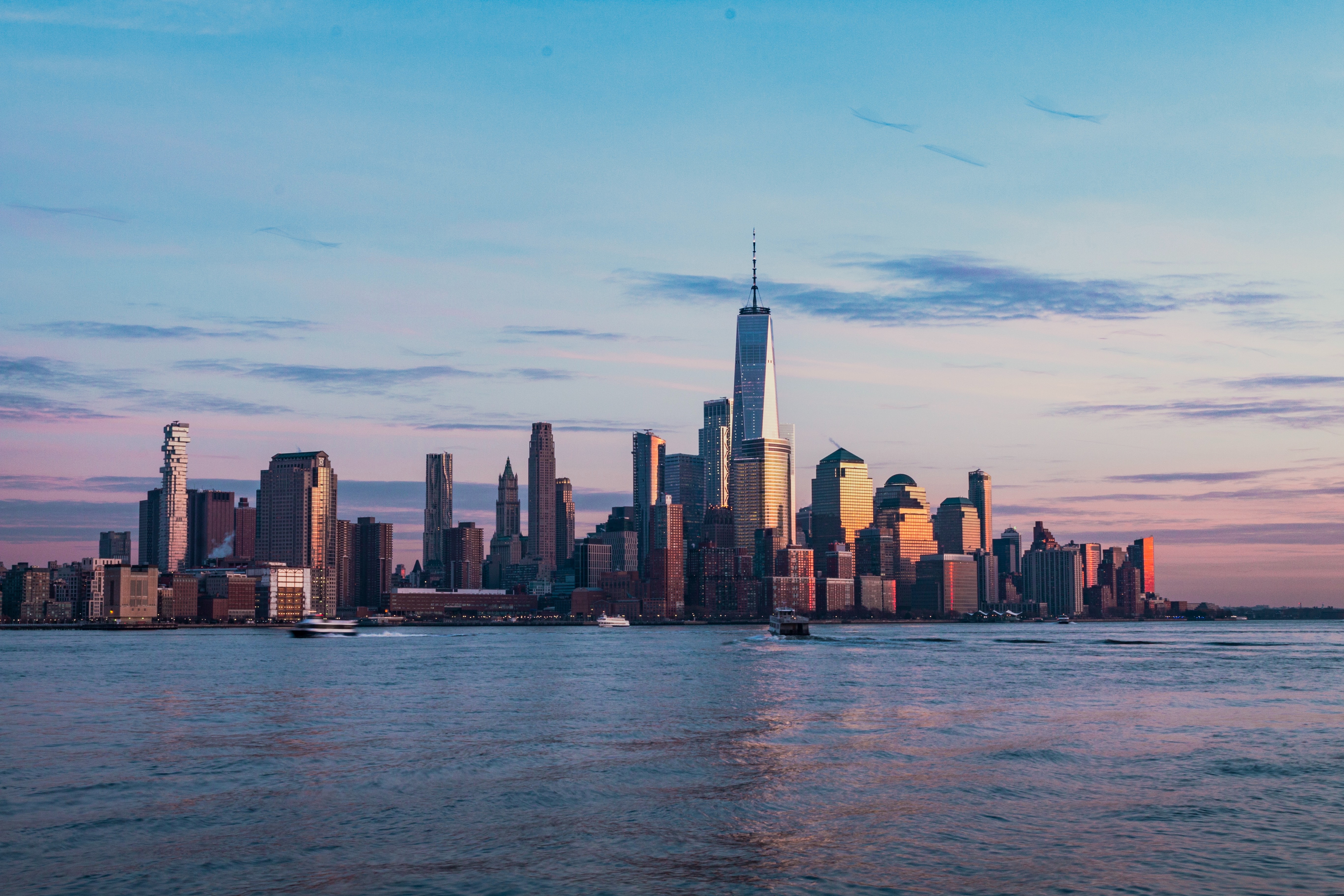 Manhattan skyline at dusk with One World Trade Center
