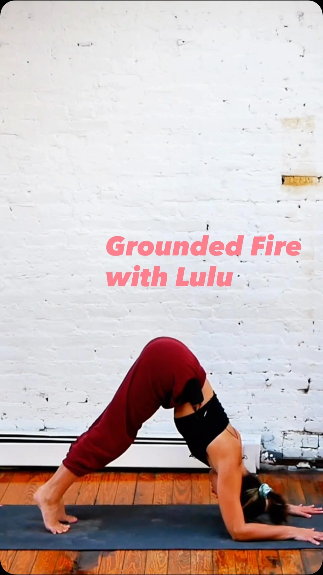 Instagram reel: Grounded Fire with Lulu, woman in down-dog on a mat