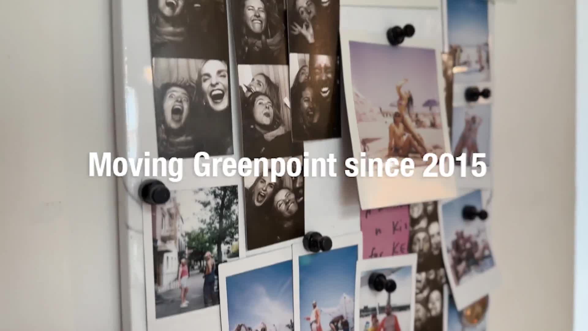 New Love City studio interior — a wall of polaroid photos, plants and warm wood floors, with the text Moving Greenpoint since 2015