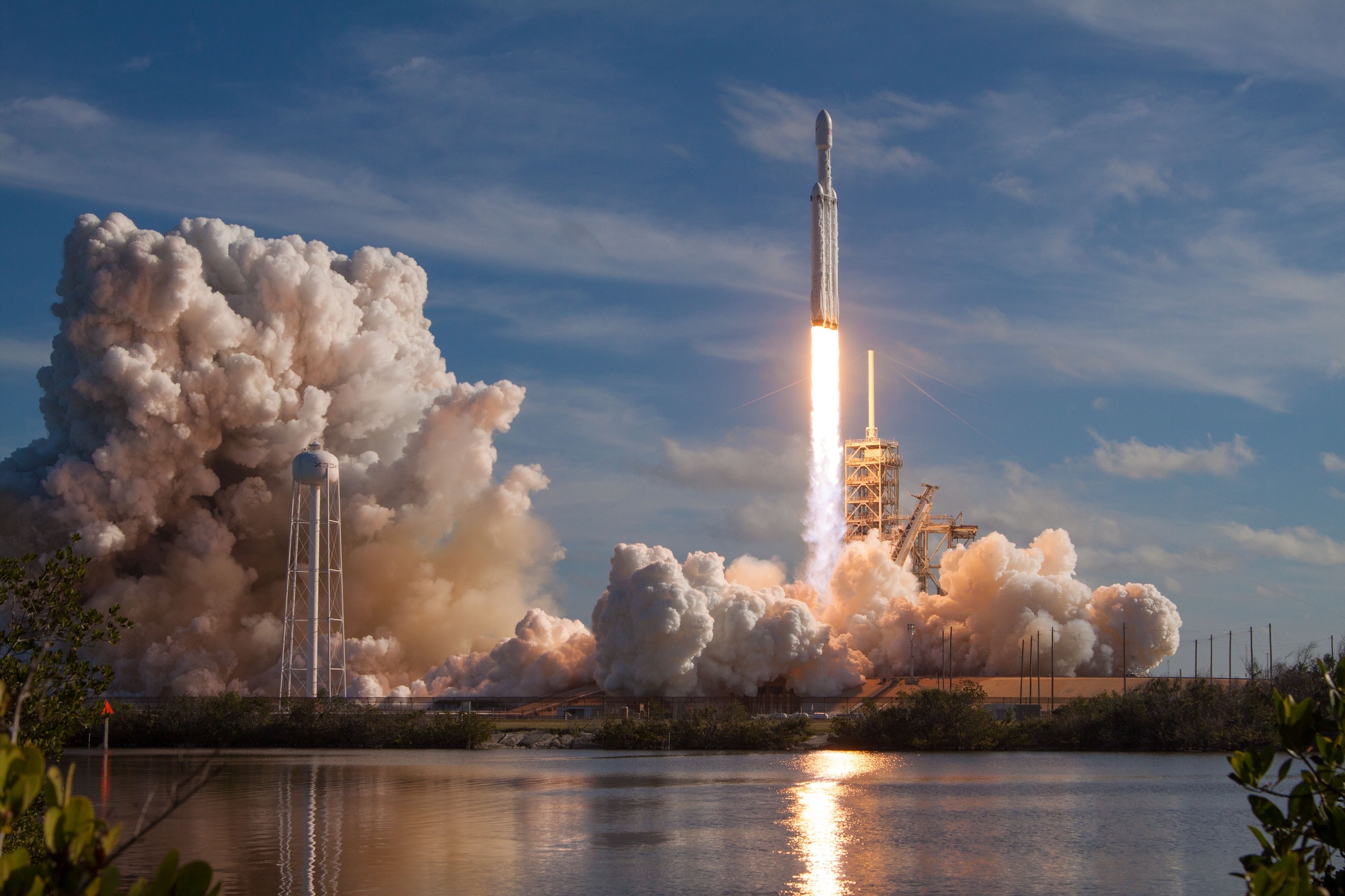 Rocket launching with large clouds of smoke over water