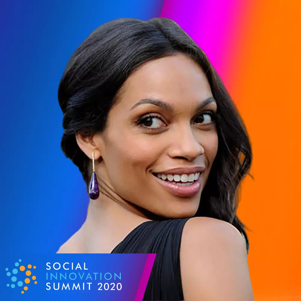 Woman at the Social Innovation Summit 2020 photo booth on a colorful gradient